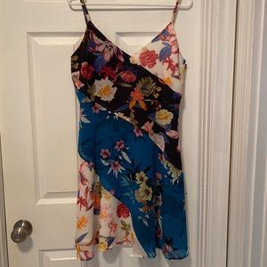 Knee length spaghetti strap party dress.